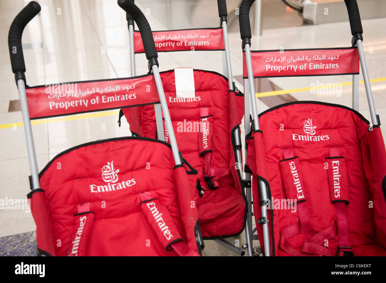 Emirates baby strollers at Dubai International Airport Stock Photo - Alamy