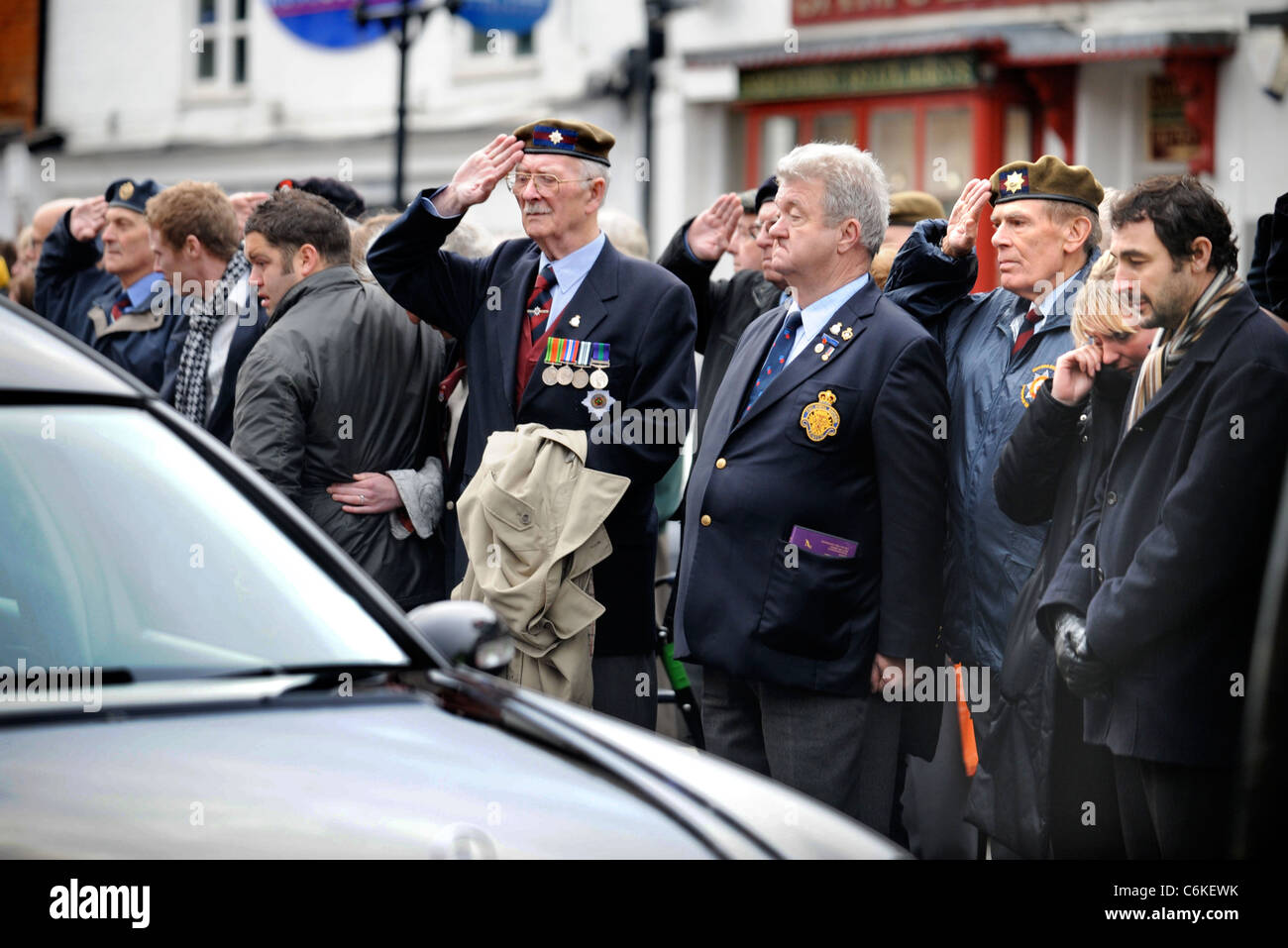 Military veterans amongst mourners gathered for a repatriation ceremony at Wootton Bassett, Wiltshire UK Dec 2008 Stock Photo