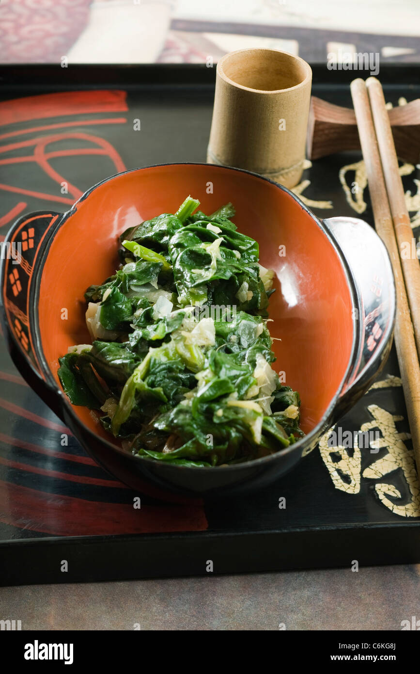 Sauteed spinach with onions and ginger Stock Photo - Alamy