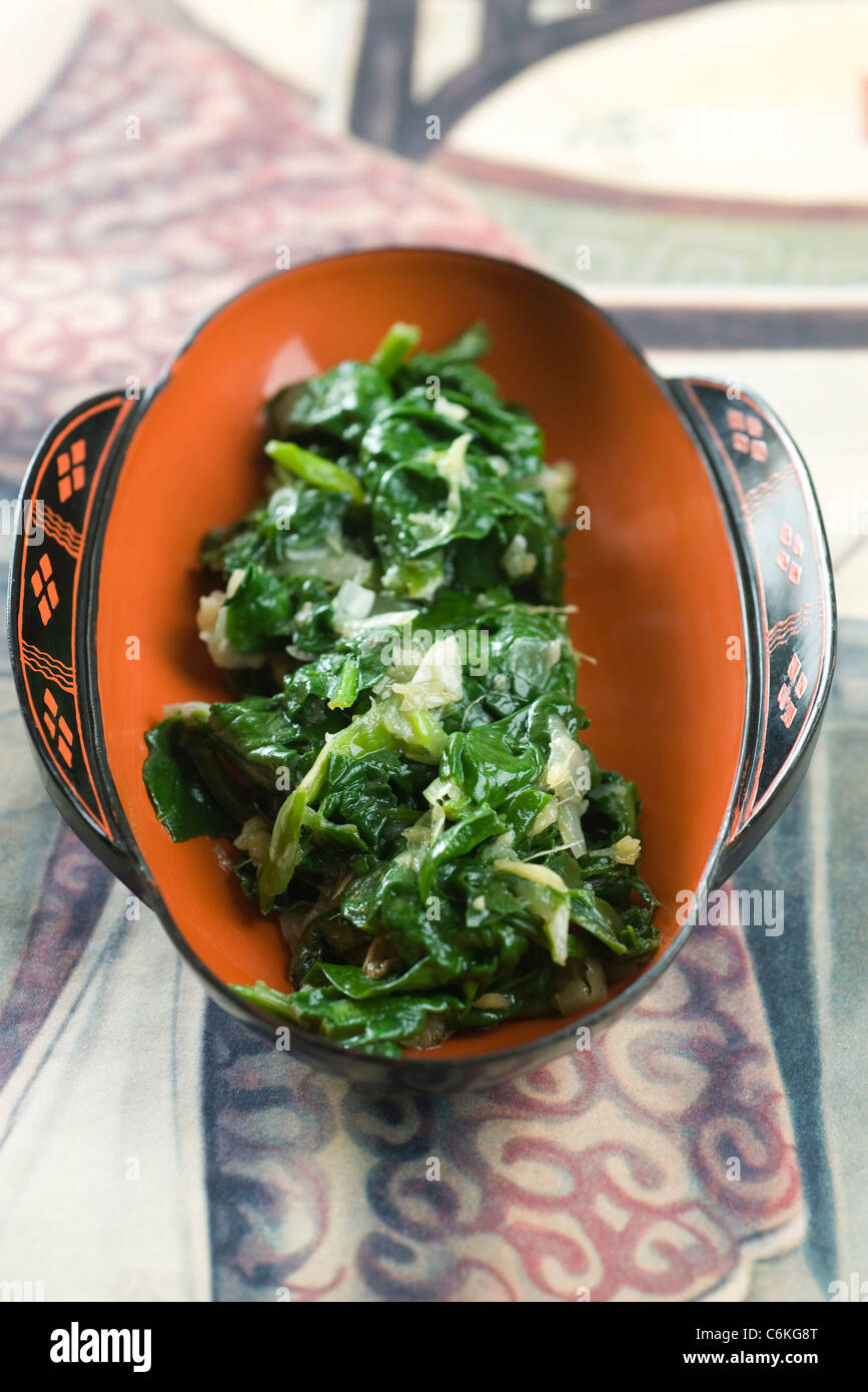 Sauteed spinach with onions and ginger Stock Photo - Alamy