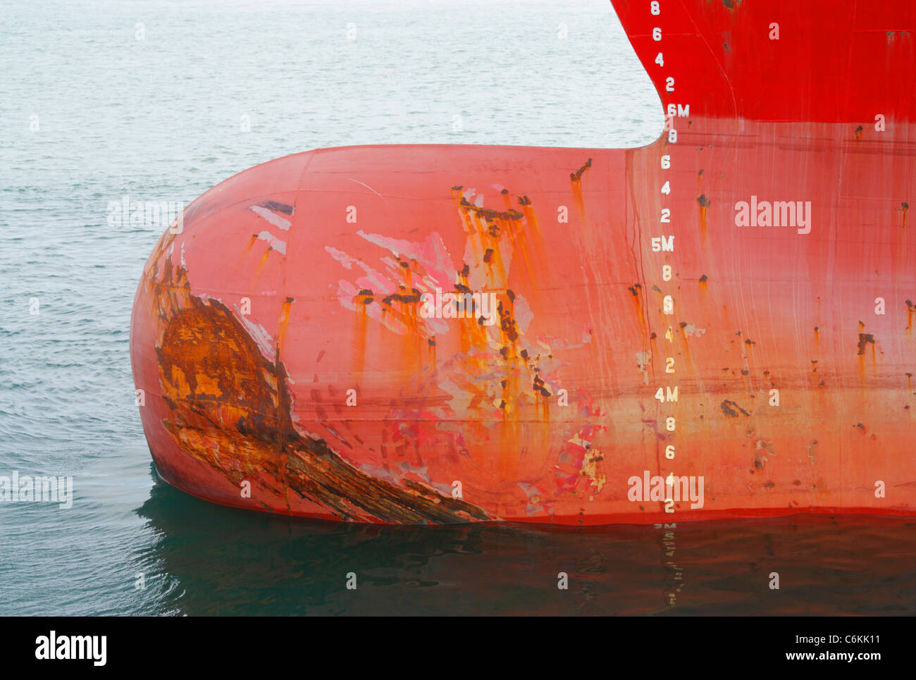 Sraped and dented bow of large merchant ship Stock Photo