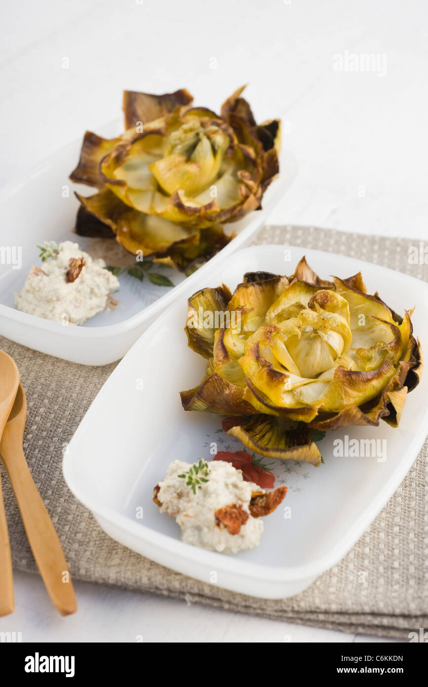 Fried artichokes with ricotta and sundried tomato dip Stock Photo