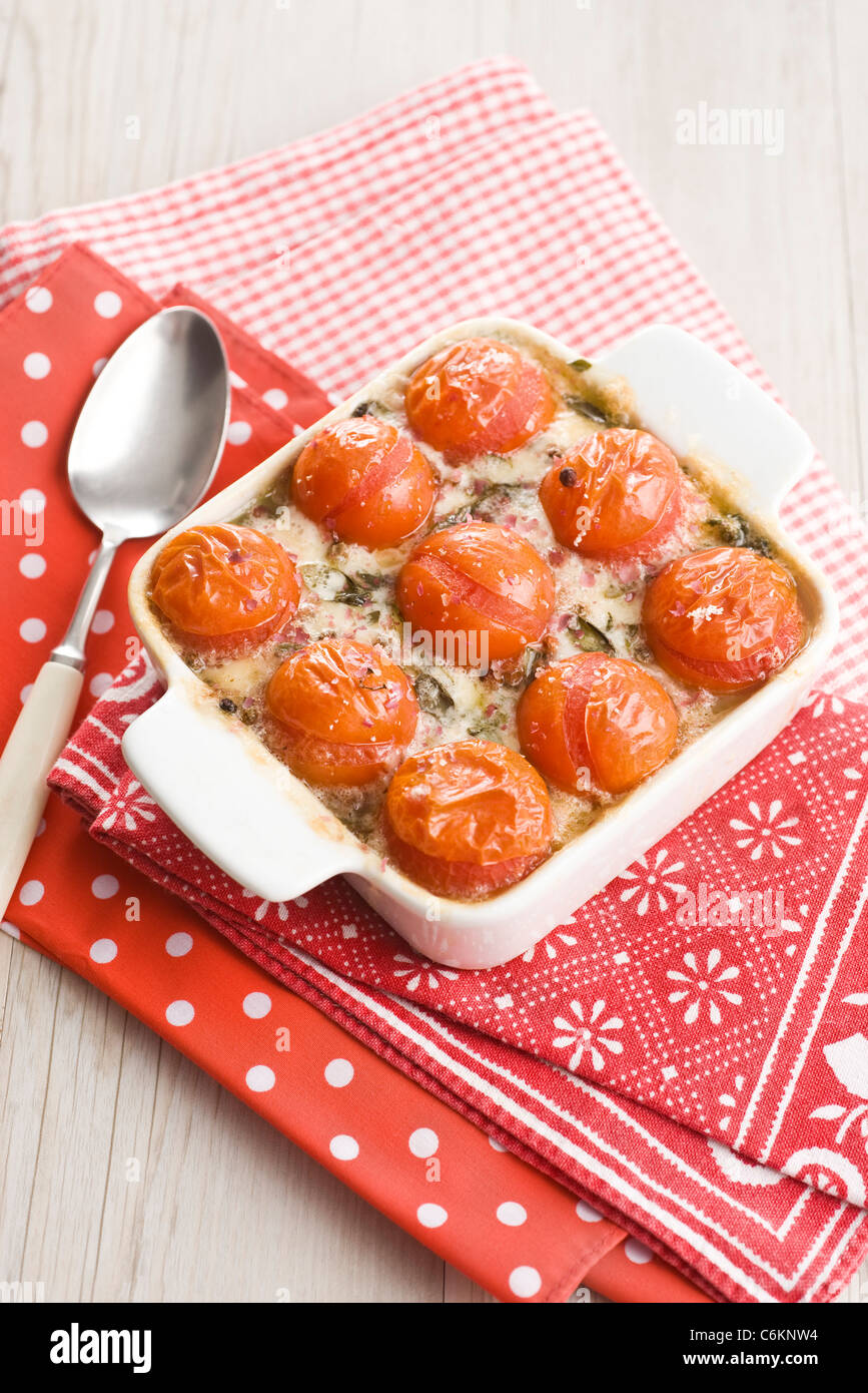 Mozzarella gratin with spinach and cherry tomatoes Stock Photo Alamy