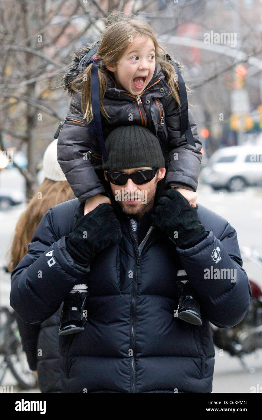 Hugh Jackman carries his daughter Ava Eliot Jackman while walking ...