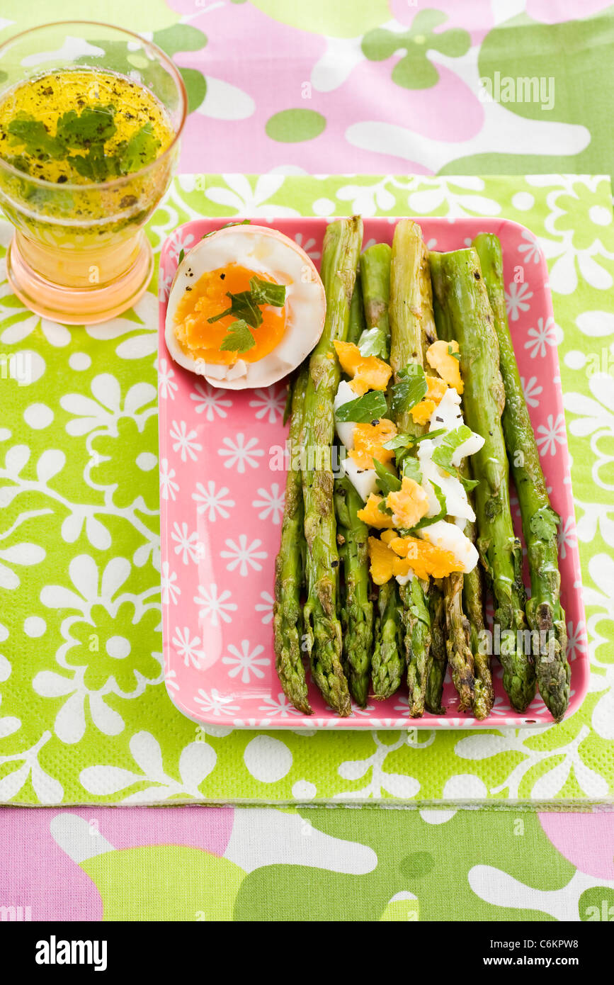 Green asparagus with soft-boiled eggs Stock Photo
