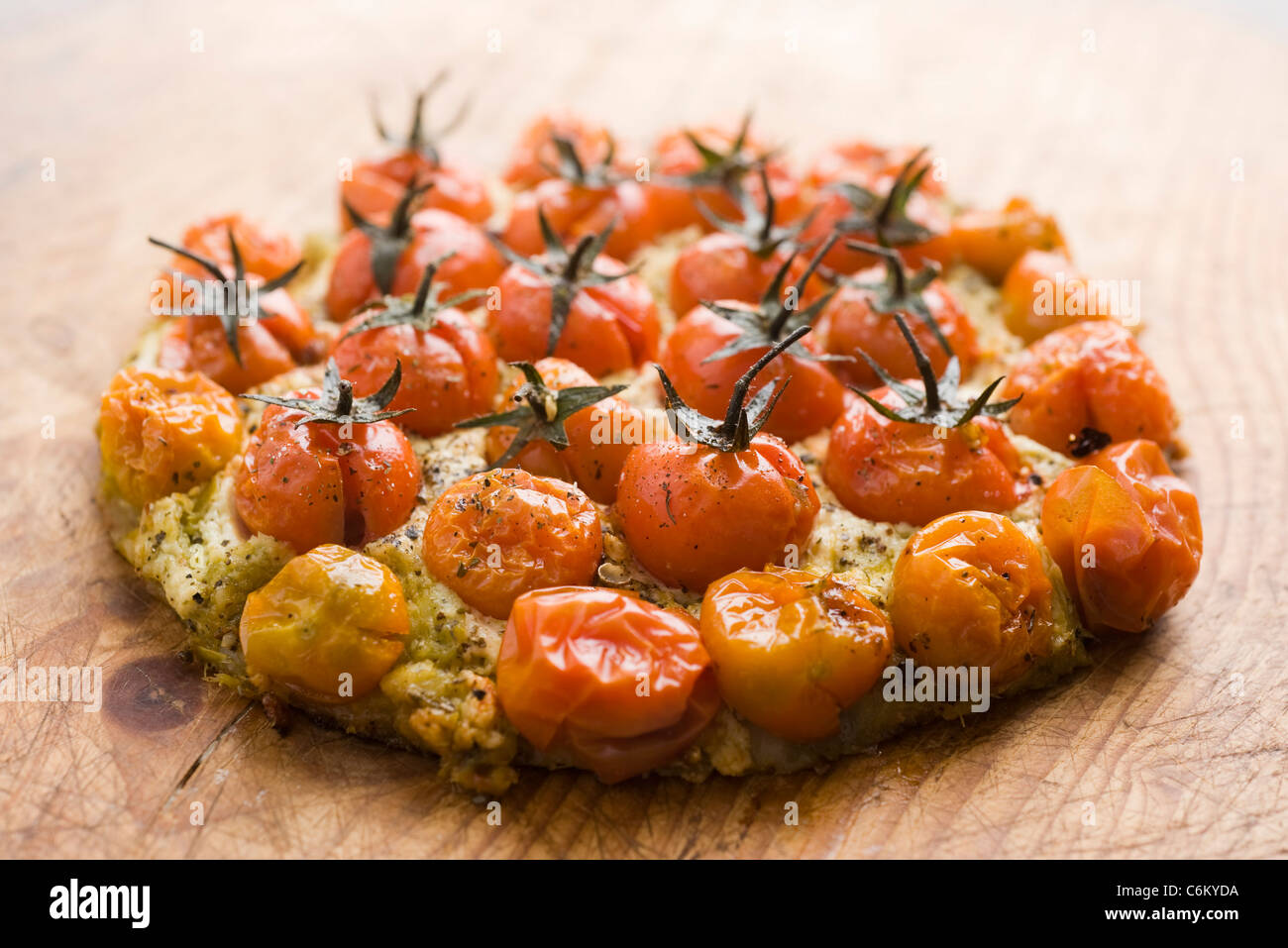 Pizza with cherry tomatoes, pesto and ricotta Stock Photo Alamy