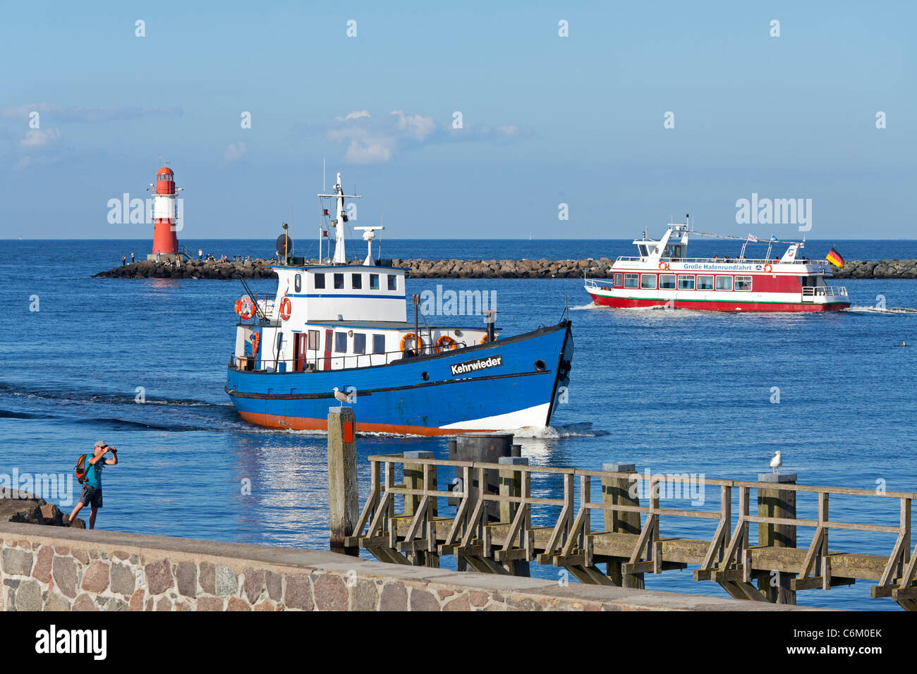 excursion boats at the mouth of River Warnow, Warnemuende, Rostock