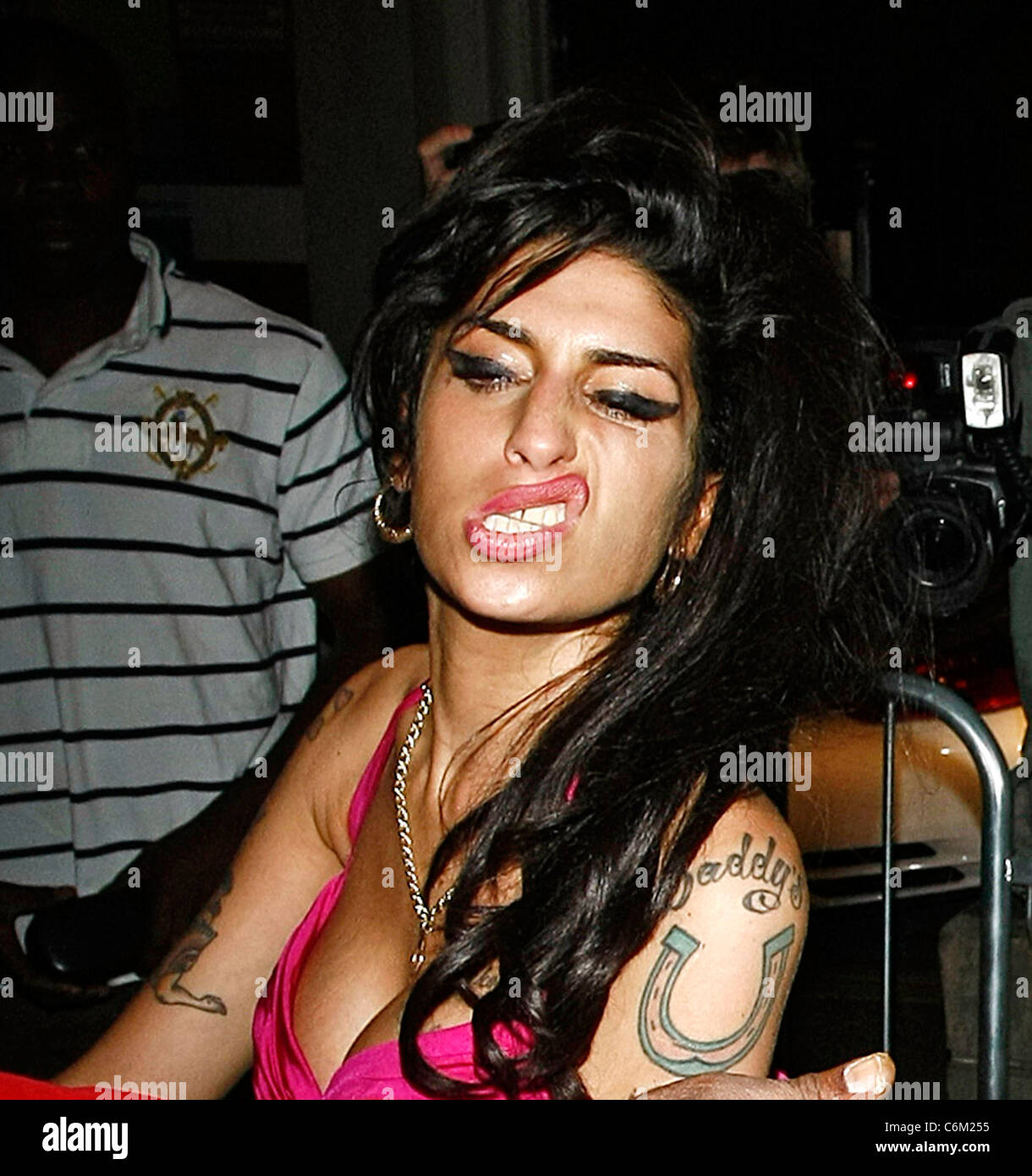 Amy winehouse in pink top hi-res stock photography and images - Alamy