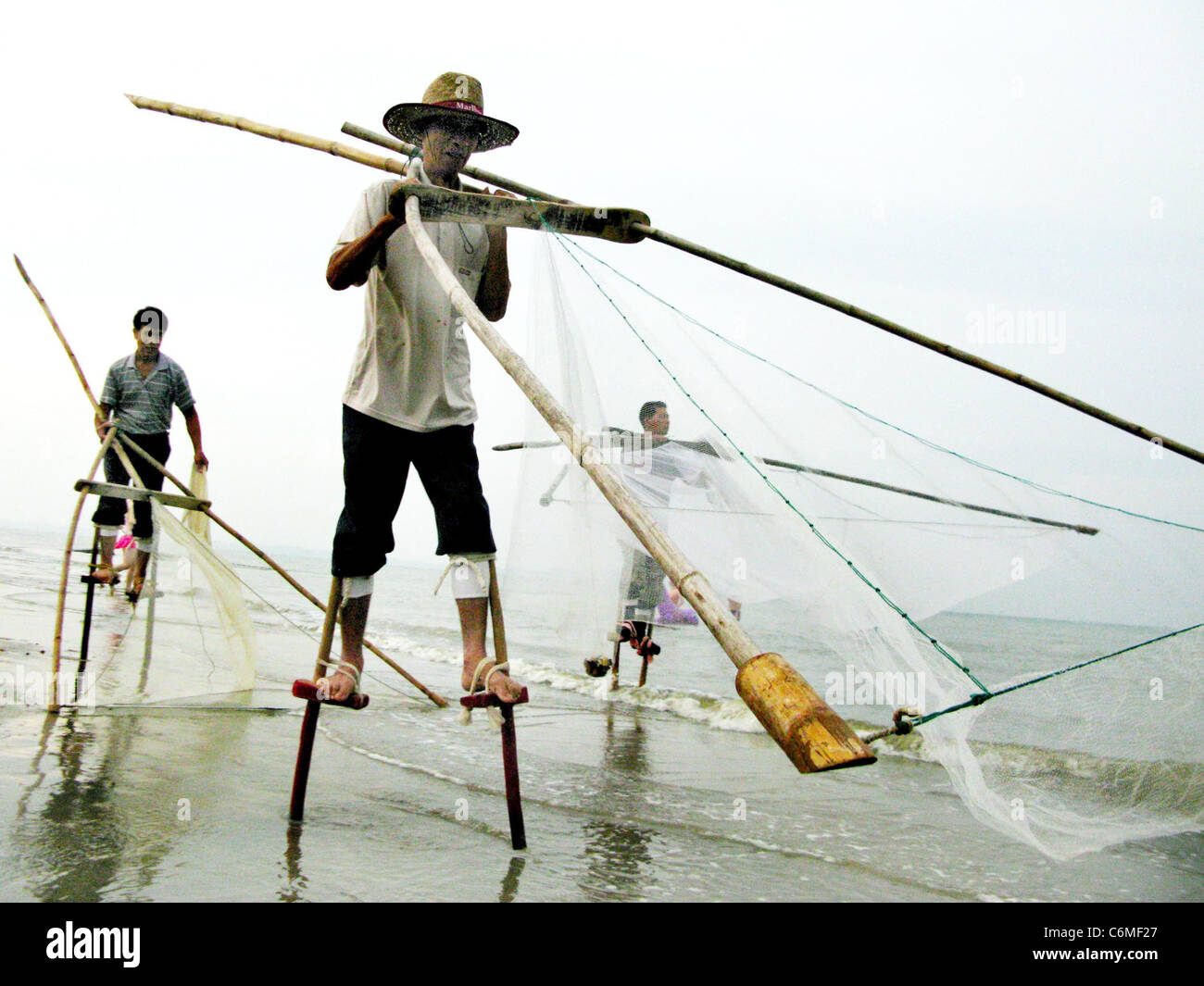 Chinese locals practice ancient method of fishing Local fishermen in the  Dongxin, Guangxi district of China practice a Stock Photo - Alamy