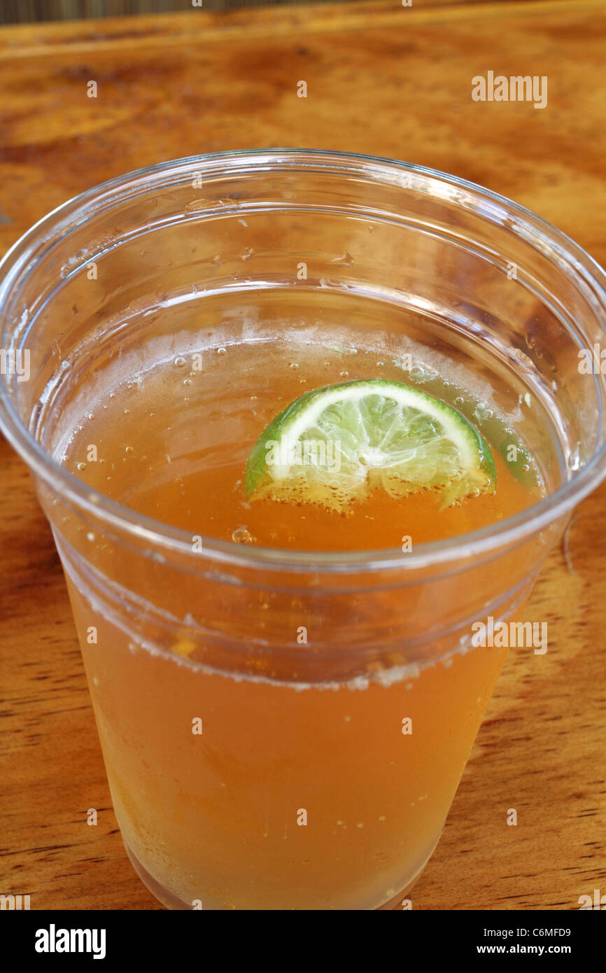 A Corona beer with a lime wedge served in a plastic cup and enjoyed at a  tiki bar in Long Branch, New Jersey, USA Stock Photo - Alamy