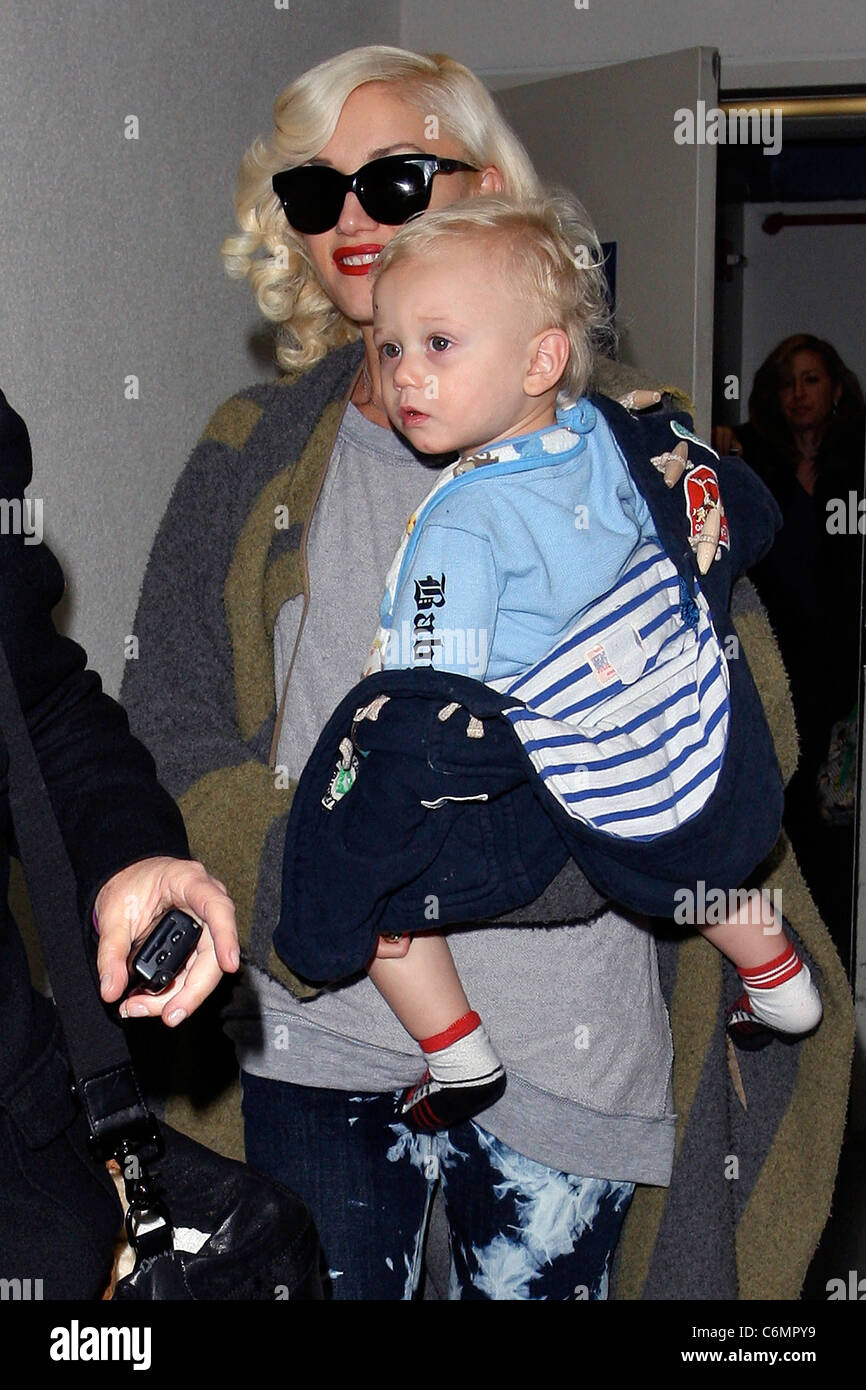 Gwen Stefani carries her son, Zuma, as they arrive at LAX airport. Los