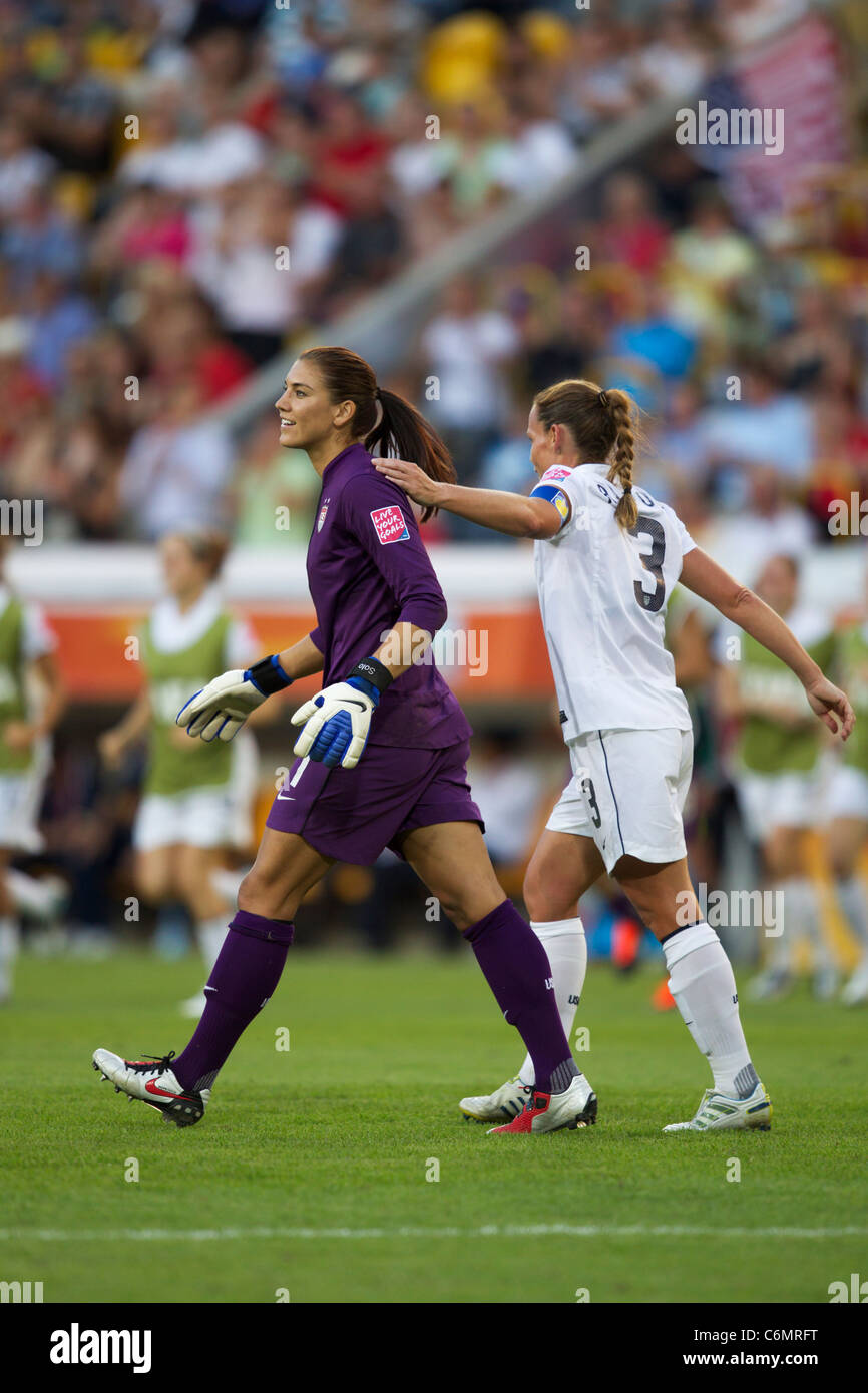 USA goalkeeper Hope Solo (l) and team captain Christie Rampone (r) celebrate after defeating North Korea in a World Cup match. Stock Photo