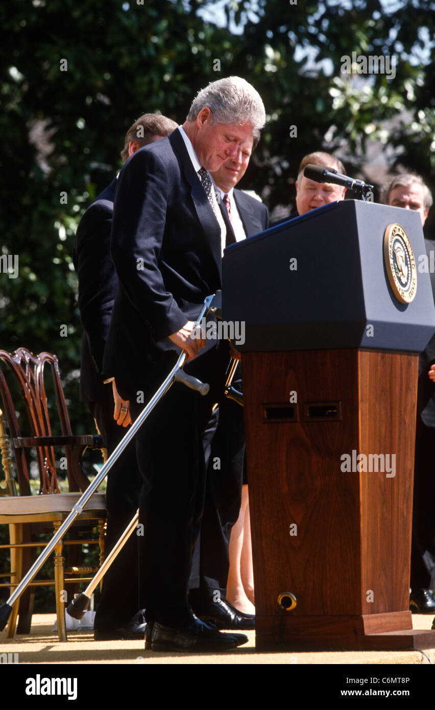 President Bill Clinton with crutches during an event on the Chemical Weapons Ban treaty Stock