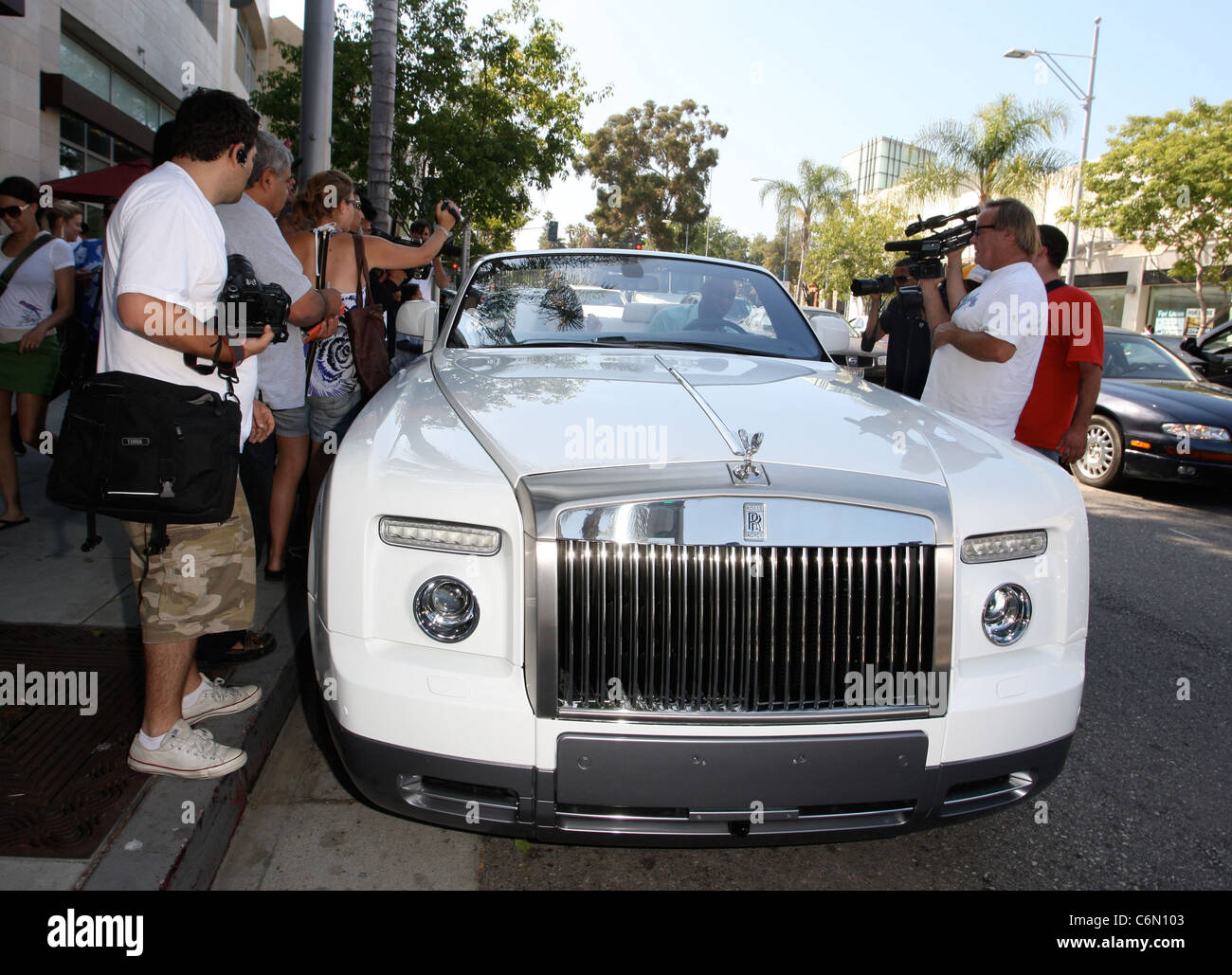 Khloe Kardashian And Husband Lamar Odom Leaving La Scala Restaurant In Their White Rolls Royce . She Left With Her Back Zip To Stock Photo - Alamy