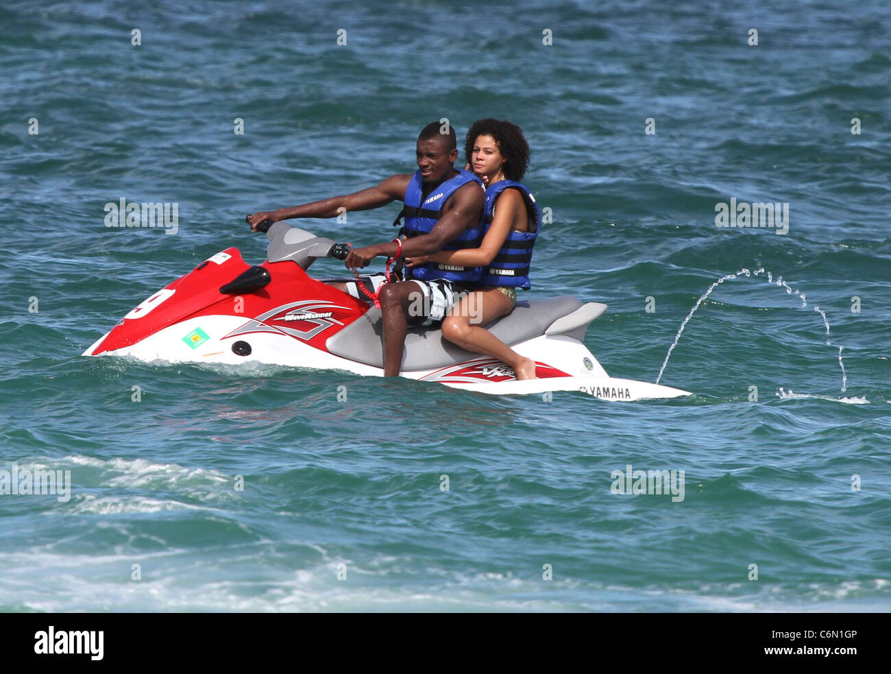 Chelsea footballer Salomon Kalou and girlfriend Anedie Azael on a jet-ski  while enjoying a beach break Miami Beach, Florida Stock Photo - Alamy