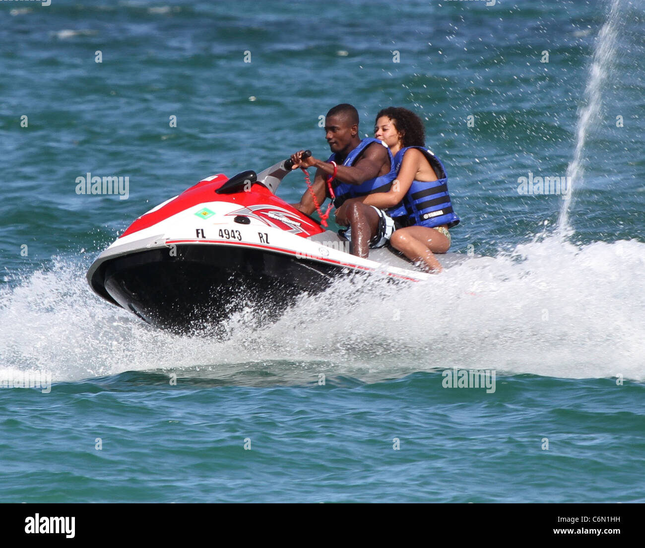footballer Salomon Kalou and girlfriend Anedie on a jet-ski while enjoying a break Miami Beach, Florida Photo - Alamy