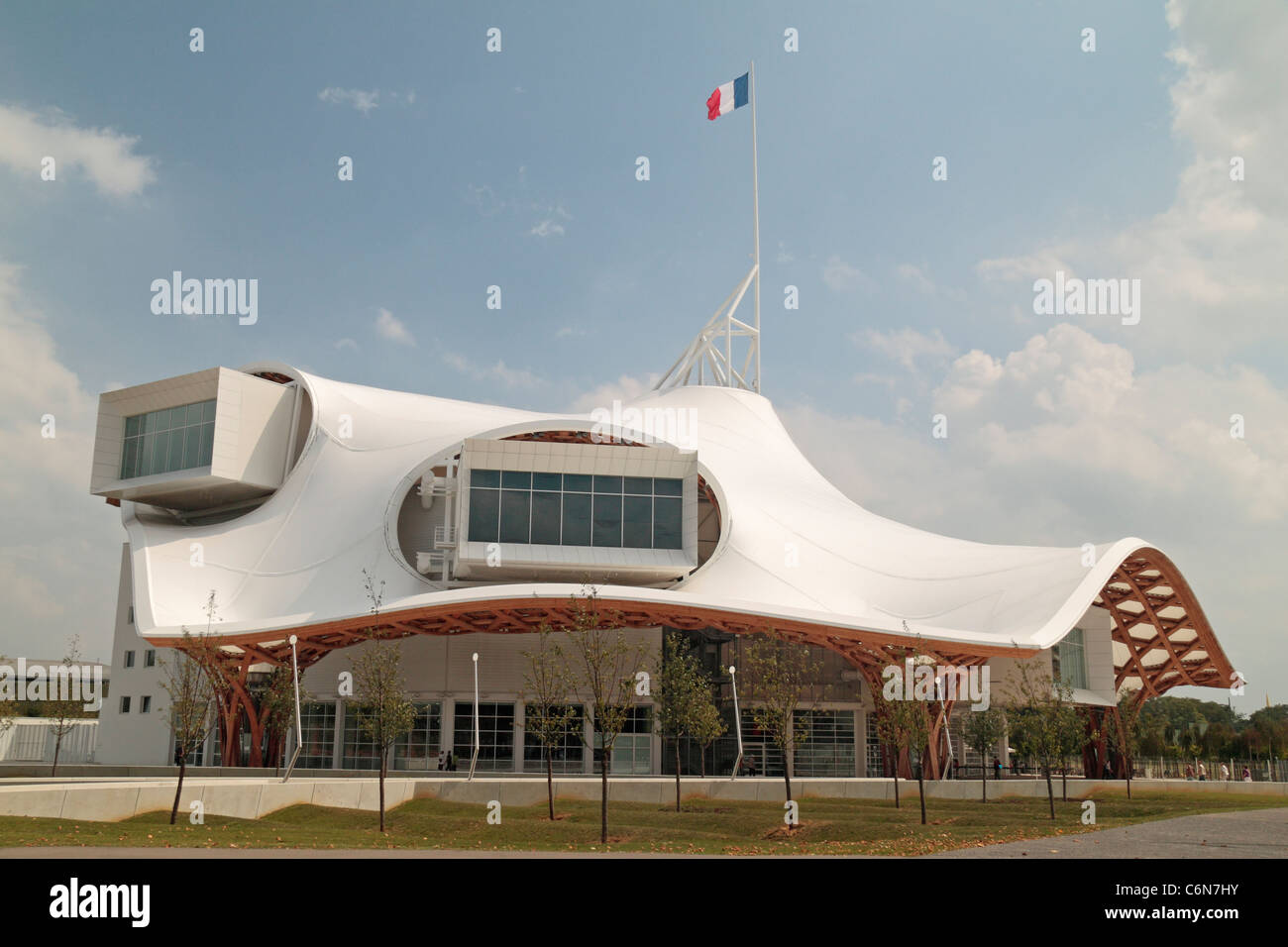 Tricolor flying above the Centre Pompidou Metz, a museum of modern and contemporary arts in Metz, Lorraine, France. Stock Photo