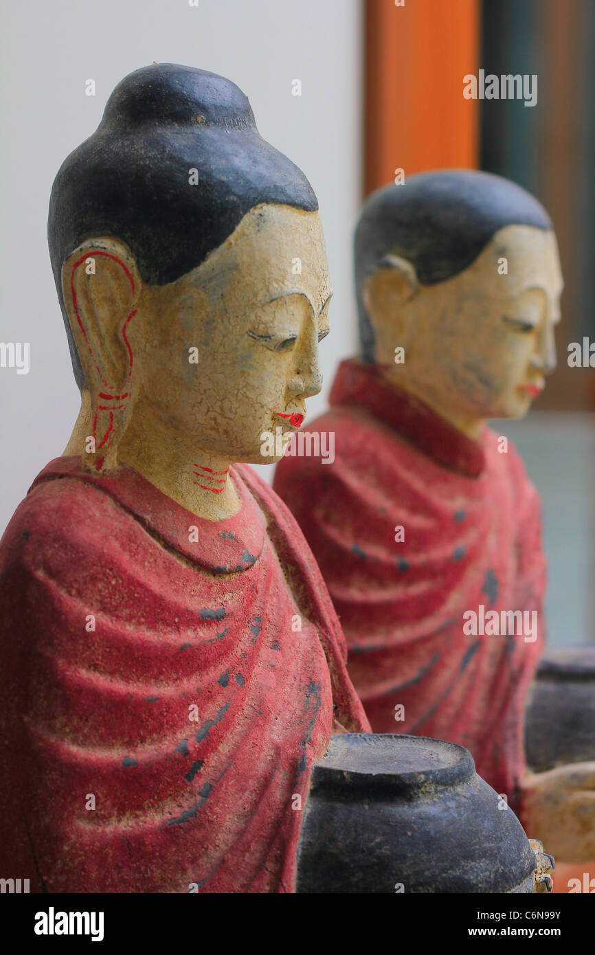 Wooden Thai Statues of Buddhist Monks Stock Photo Alamy