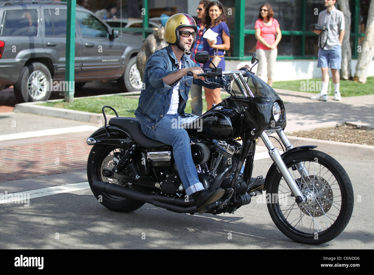 Adam Levine out and about on his motorcycle at Malibu Country Mart in  Malibu on July 4th - Independence Day Malibu, USA Stock Photo - Alamy