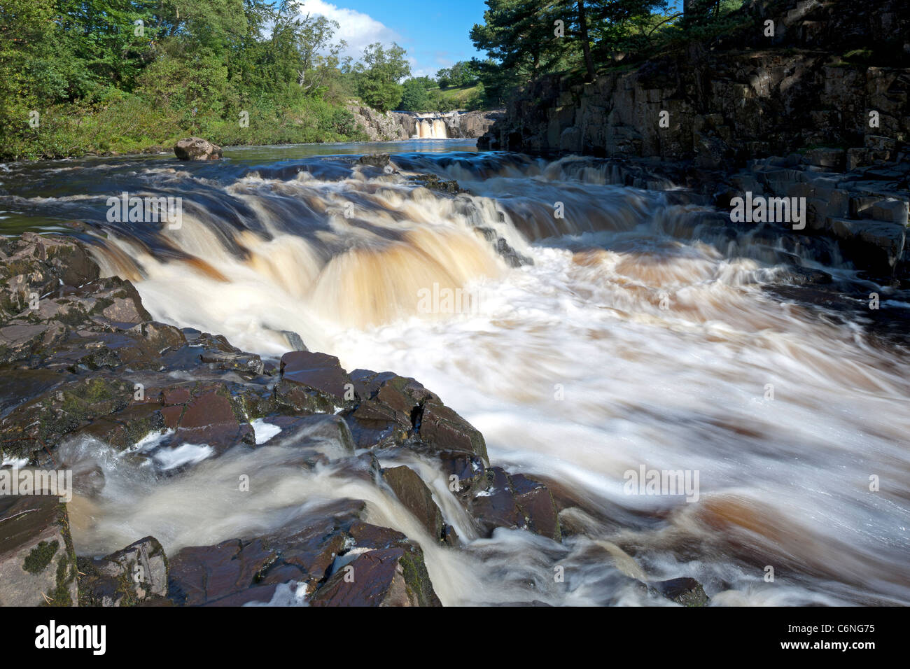Gushing water over Low Force Waterfall, near Middleton in Teesdale, County Durham Stock Photo
