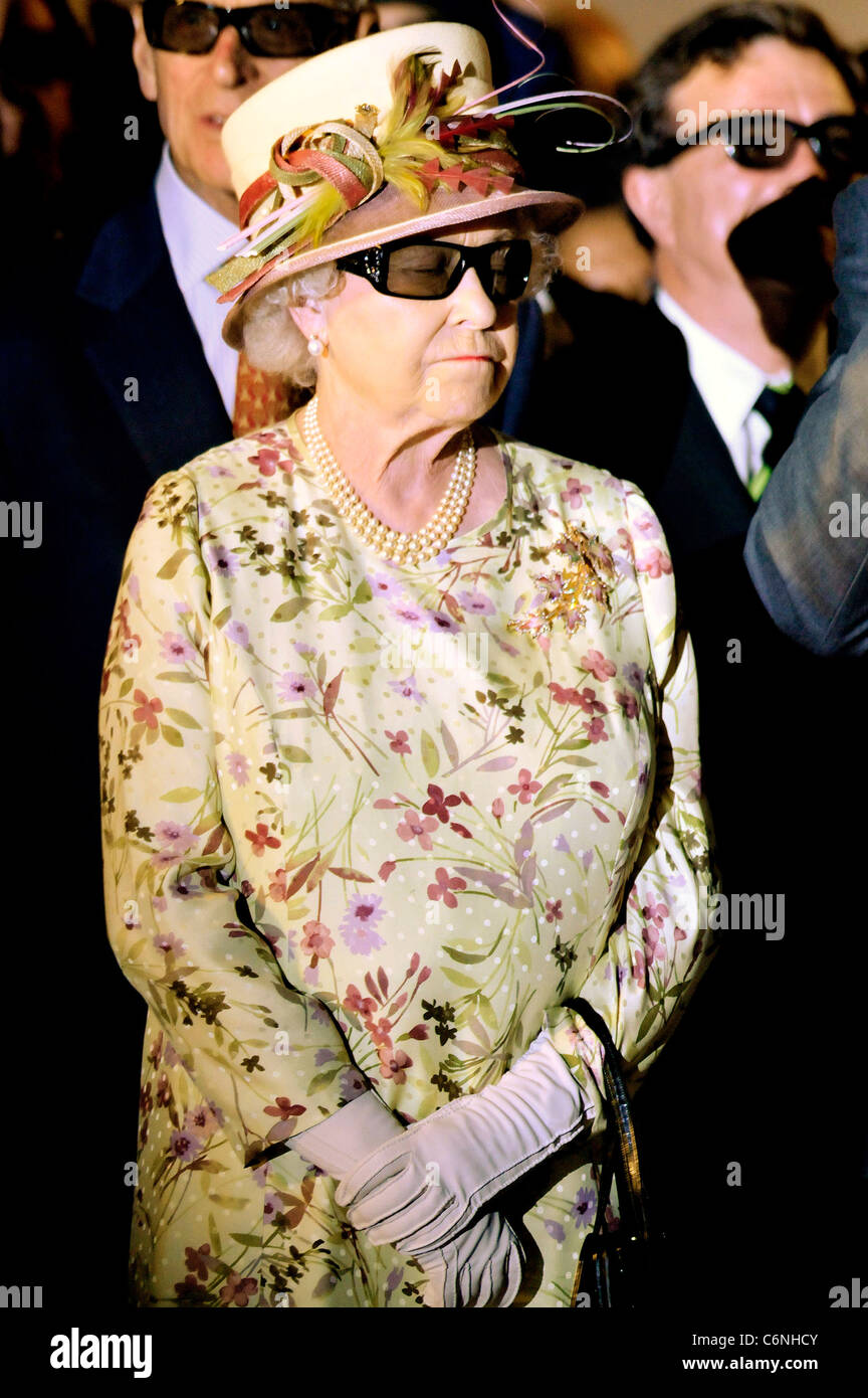 Queen Elizabeth II wears 3D spectacles as she watches a 3D display during a visit to Pinewood Studios as part of an eight day Stock Photo