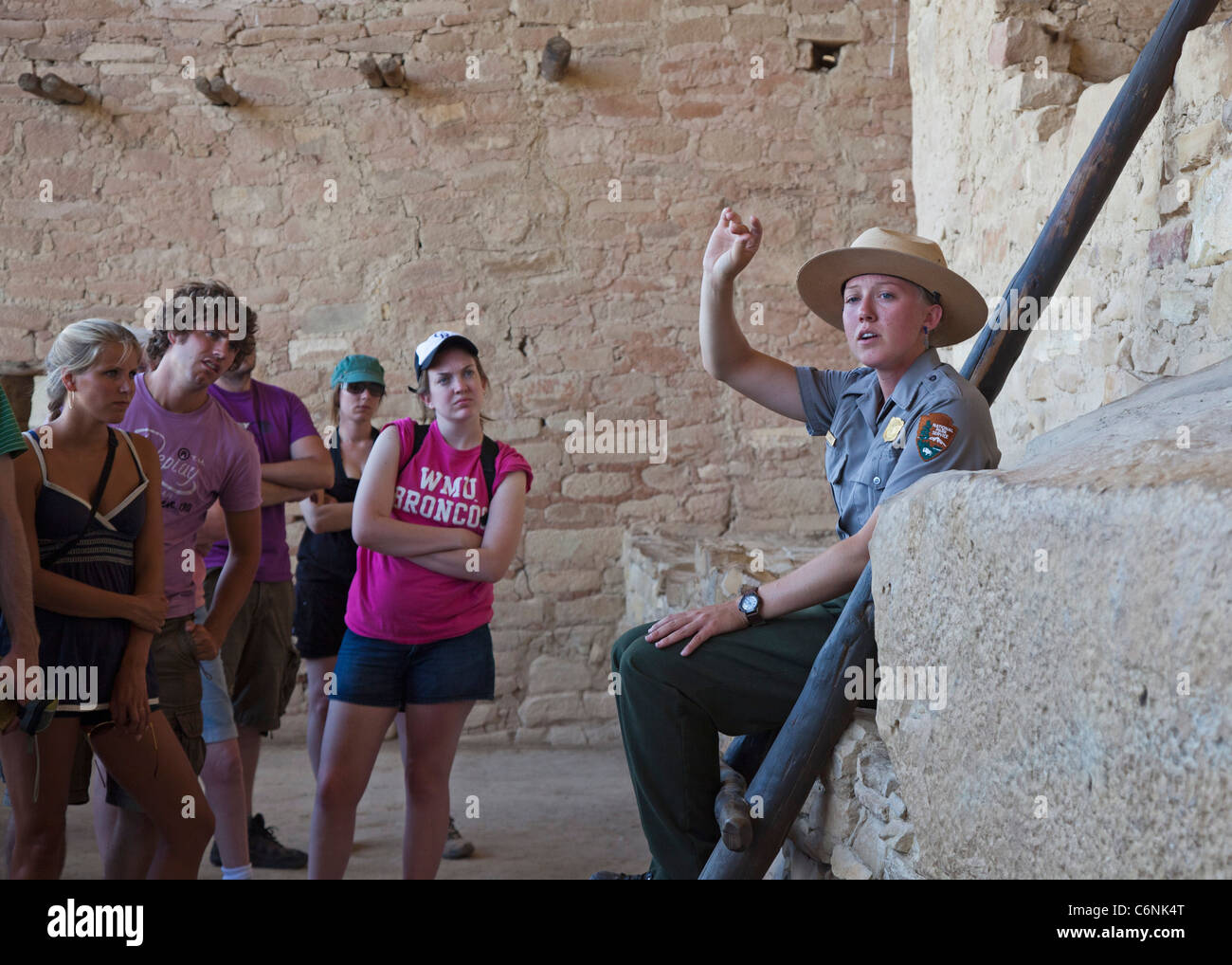 A Park Ranger Talks with Visitors on a Tour of the Balcony House cliff dwelling at Mesa Verde National Park Stock Photo