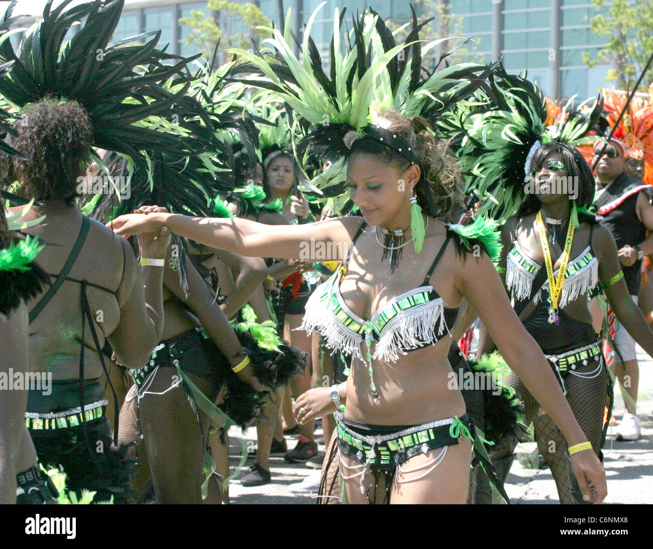 One of the people who took part in the grand Mas at the Caribana festival in Toronto, dances to the Caribbean rhymes. Stock Photo