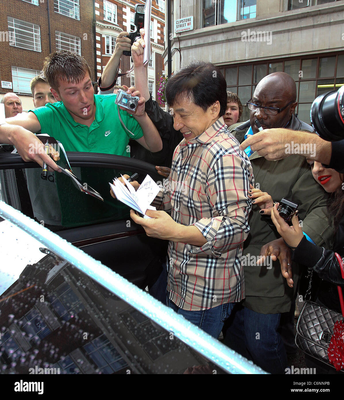 jackie-chan-is-mobbed-by-fans-as-he-leaves-the-bbc-radio-one-studios