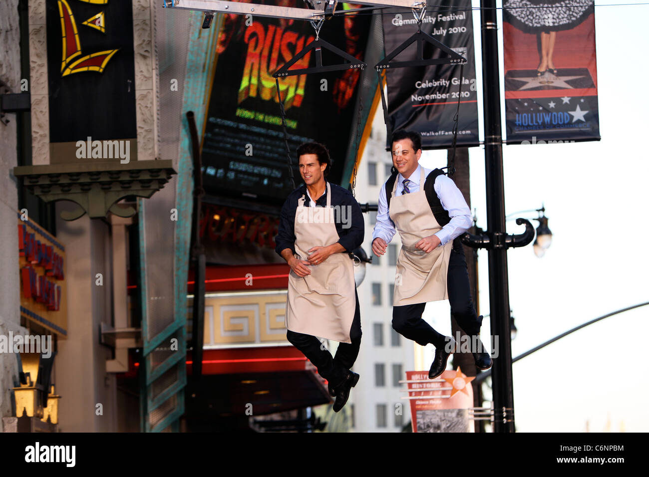 Tom Cruise And Jimmy Kimmel Hanging On A Harness Outside El