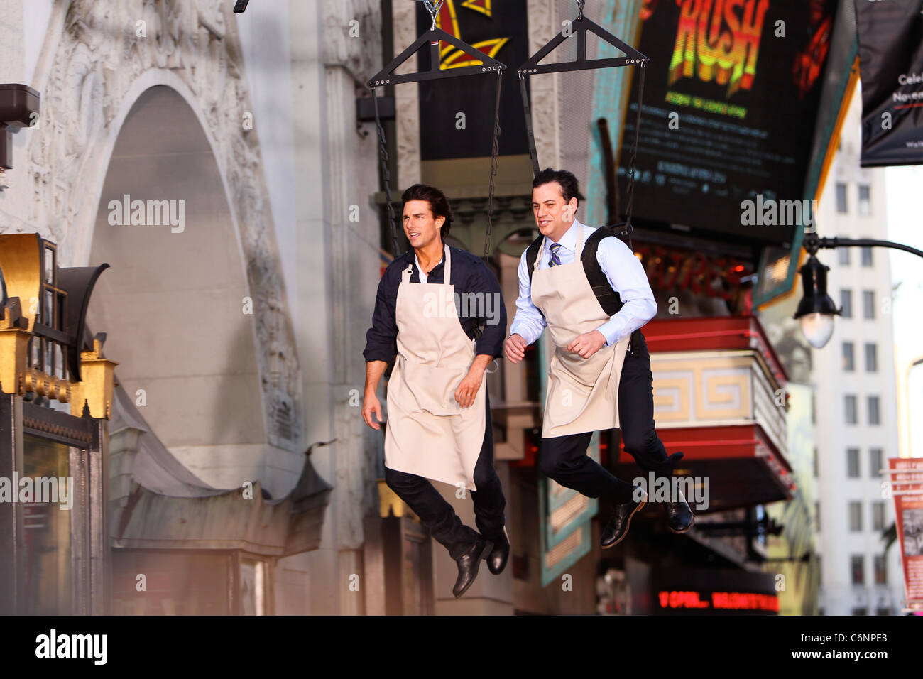 Tom Cruise And Jimmy Kimmel Hanging On A Harness Outside El