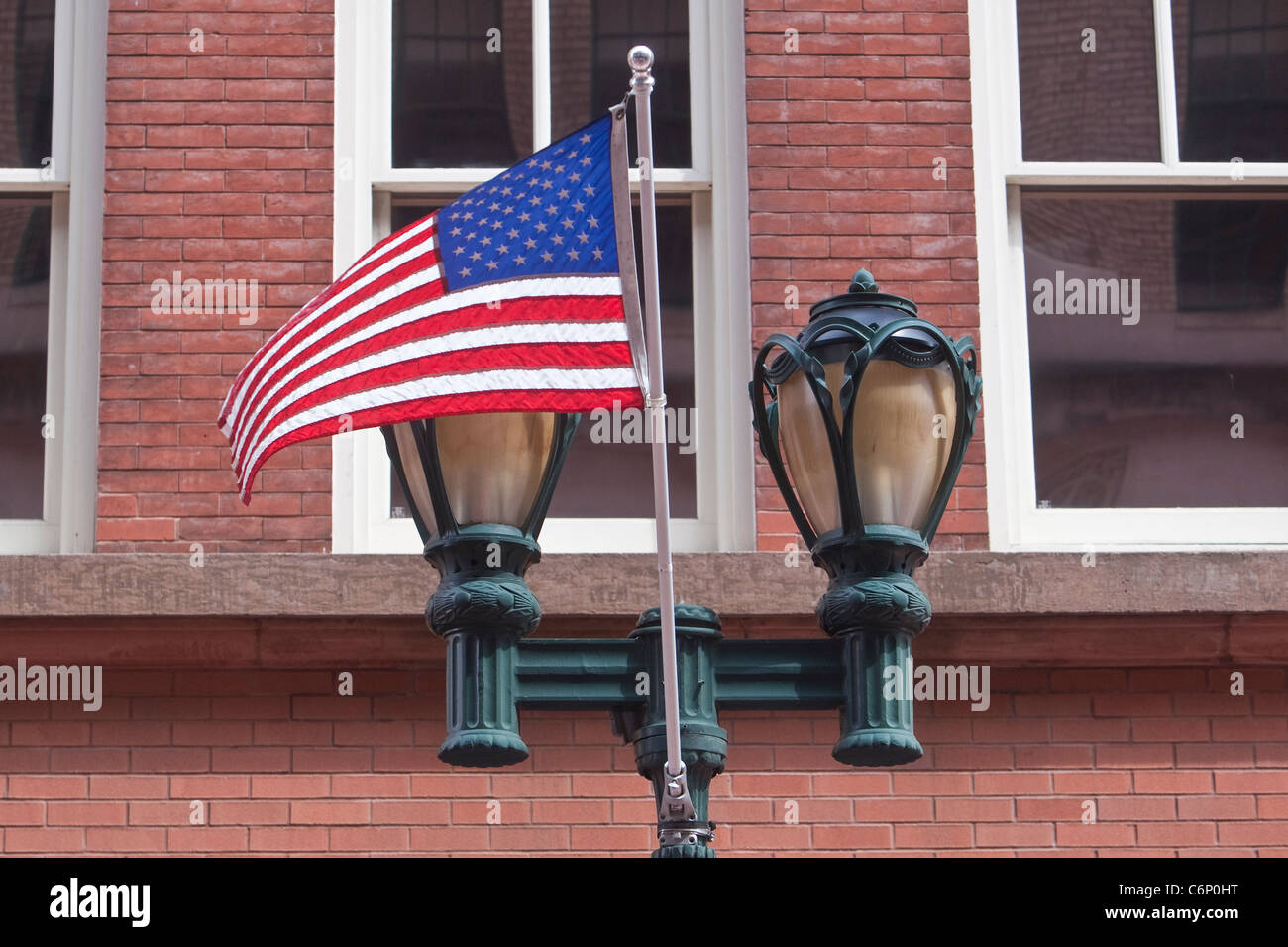 A distinctive lamppost and an American flag are pictured on Allyn Street in Hartford, Connecticut, Saturday August 6, 2011. Stock Photo