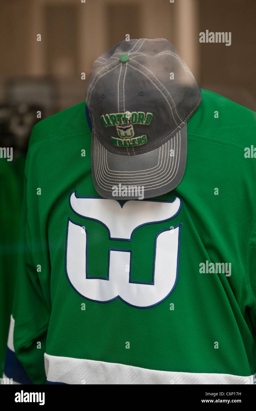 A Hartford Whalers jersey and baseball cap are seen on display in a store in Hartford, Connecticut, Saturday August 6, 2011. Stock Photo
