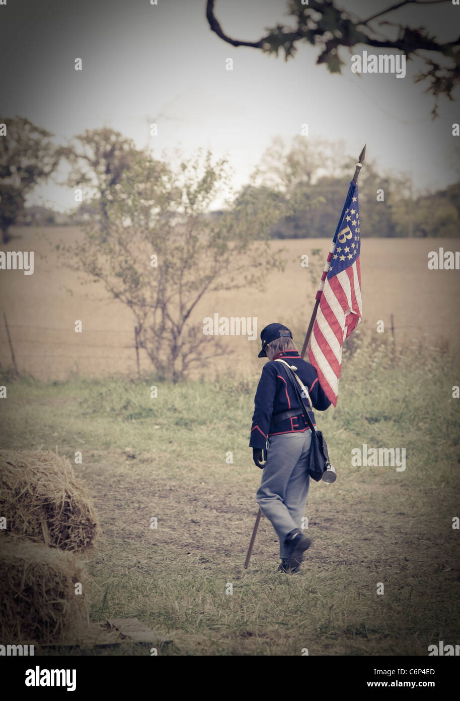 A young boy in uniform reenacts a civil war scene Stock Photo