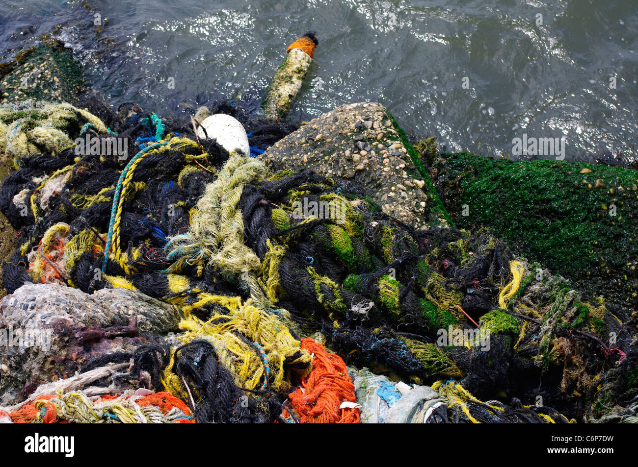 Polystyrene fishing float pulled underwater Stock Photo - Alamy