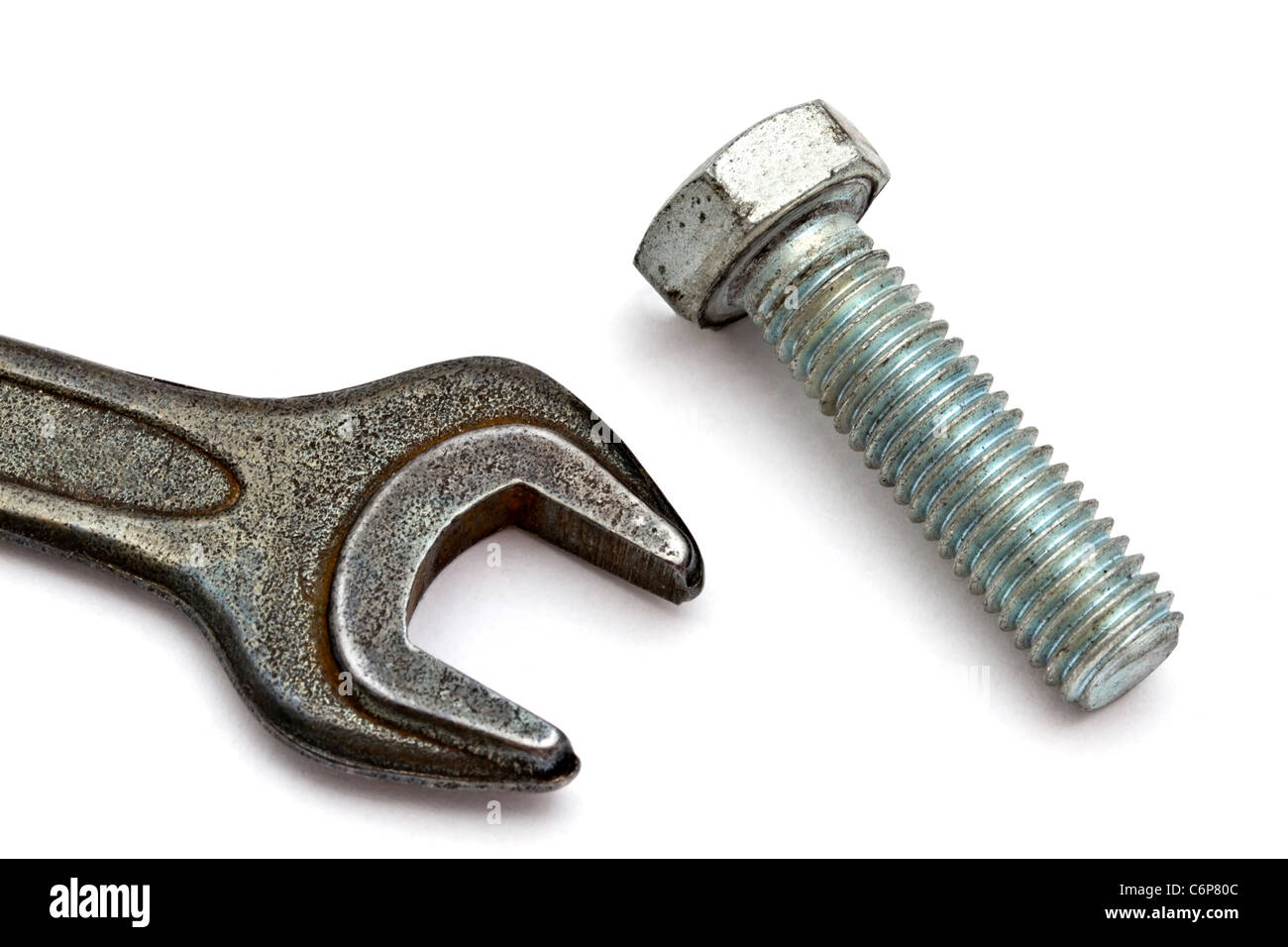 Wrench and bolt closeup on white background Stock Photo - Alamy