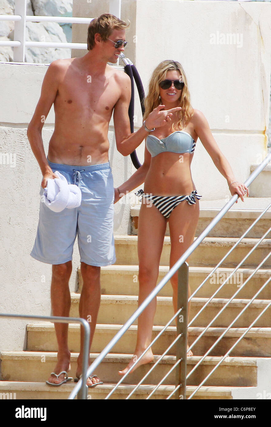Peter Crouch and Abigail Clancy, aka Abigail Clancy, aka Abbey Clancy,, English footballer Peter Crouch relaxing on holiday Stock Photo