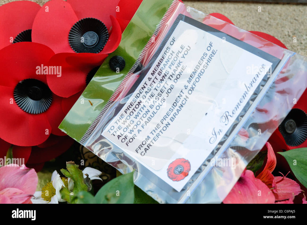 Wreaths and other items left on the ground around Royal Wootton Bassett war memorial. Stock Photo