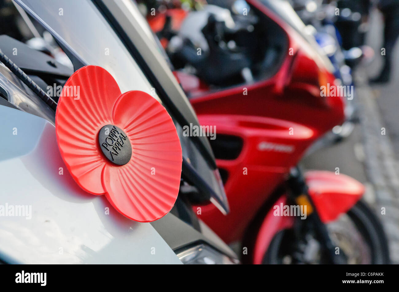 Large British Legion poppy on the front of a motorcycle Stock Photo