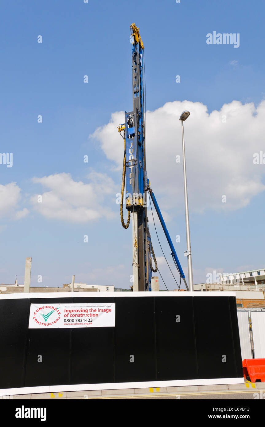 Pile driver in the process of driving concrete pile foundations Stock Photo