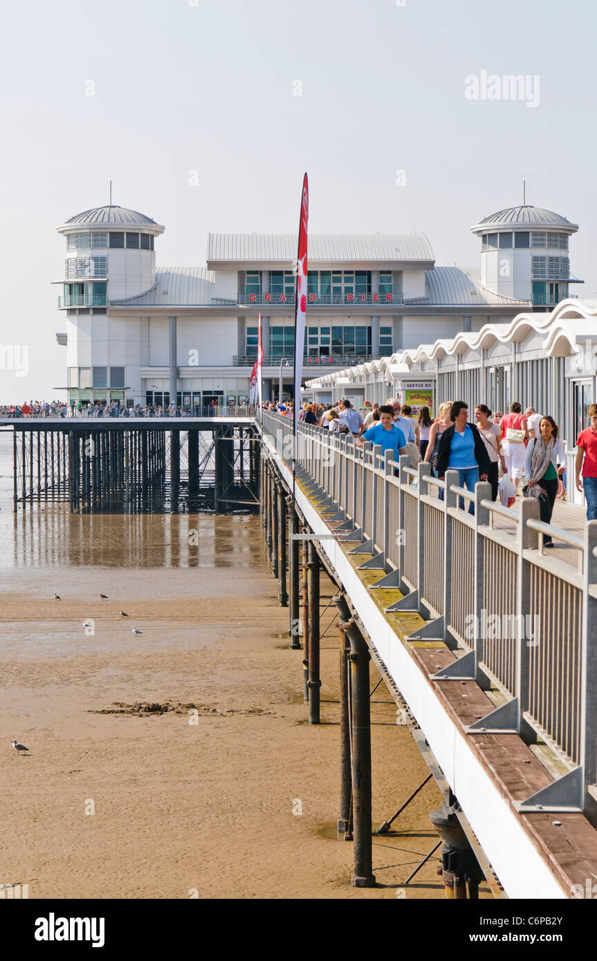 People walk along the Grand Pier at Weston-Super-Mare Stock Photo