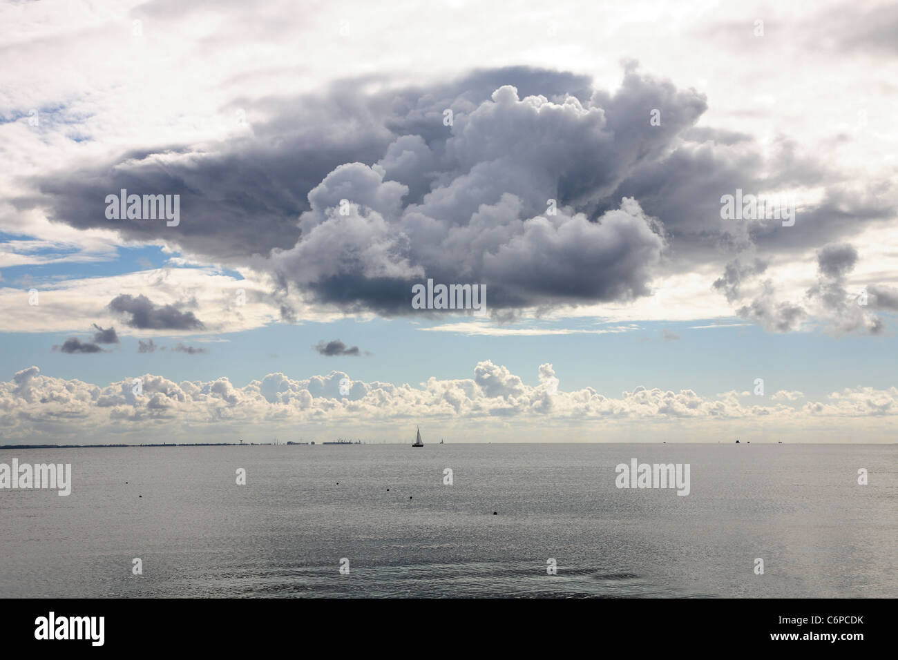 Late summer sky with cloud predicting thunderstorm (Single Cell Cumulonimbus)  over the Sound seen from Rungsted Kyst, Denmark Stock Photo