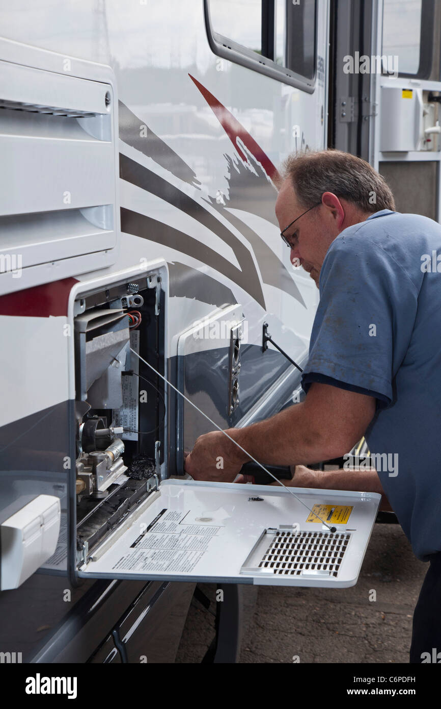 Wixom, Michigan A worker repairs an RV in the shop of a recreational