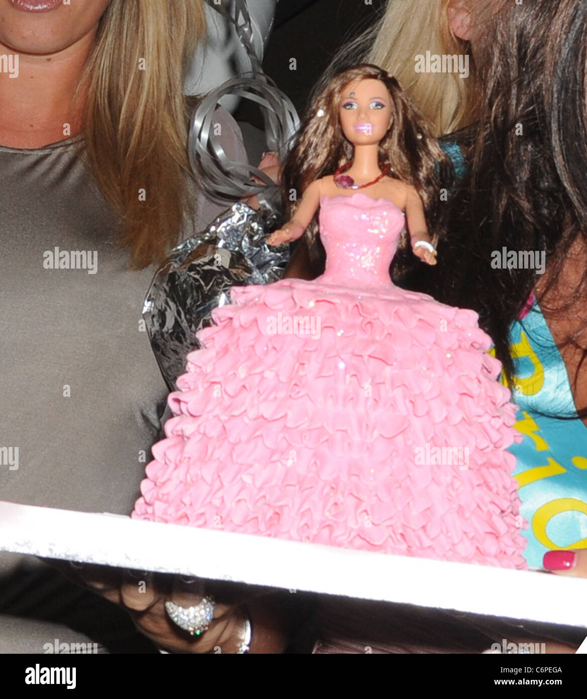 Katie Price leaving the May Fair with a pink barbie like doll cake