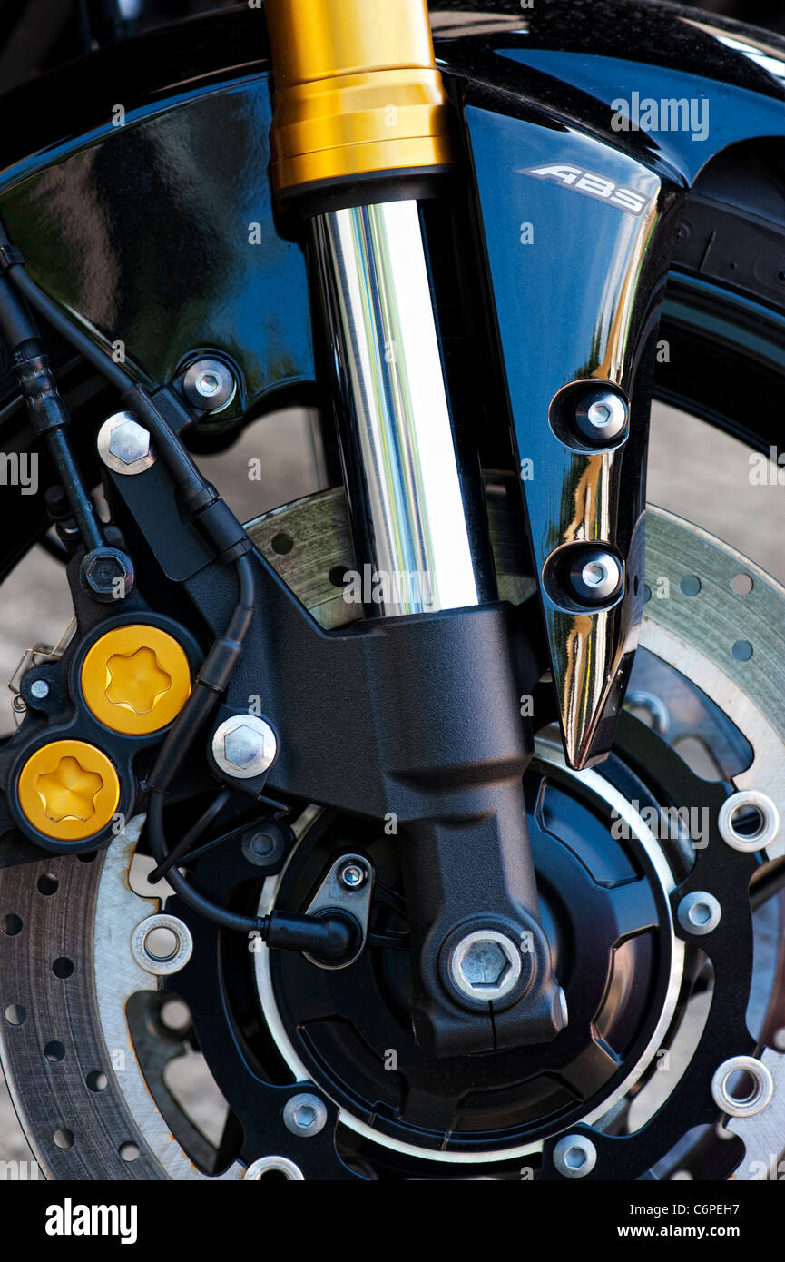 Sports Motorcycle front wheel. Front forks and brake disc detail. Sports Motorcycle detail Stock Photo