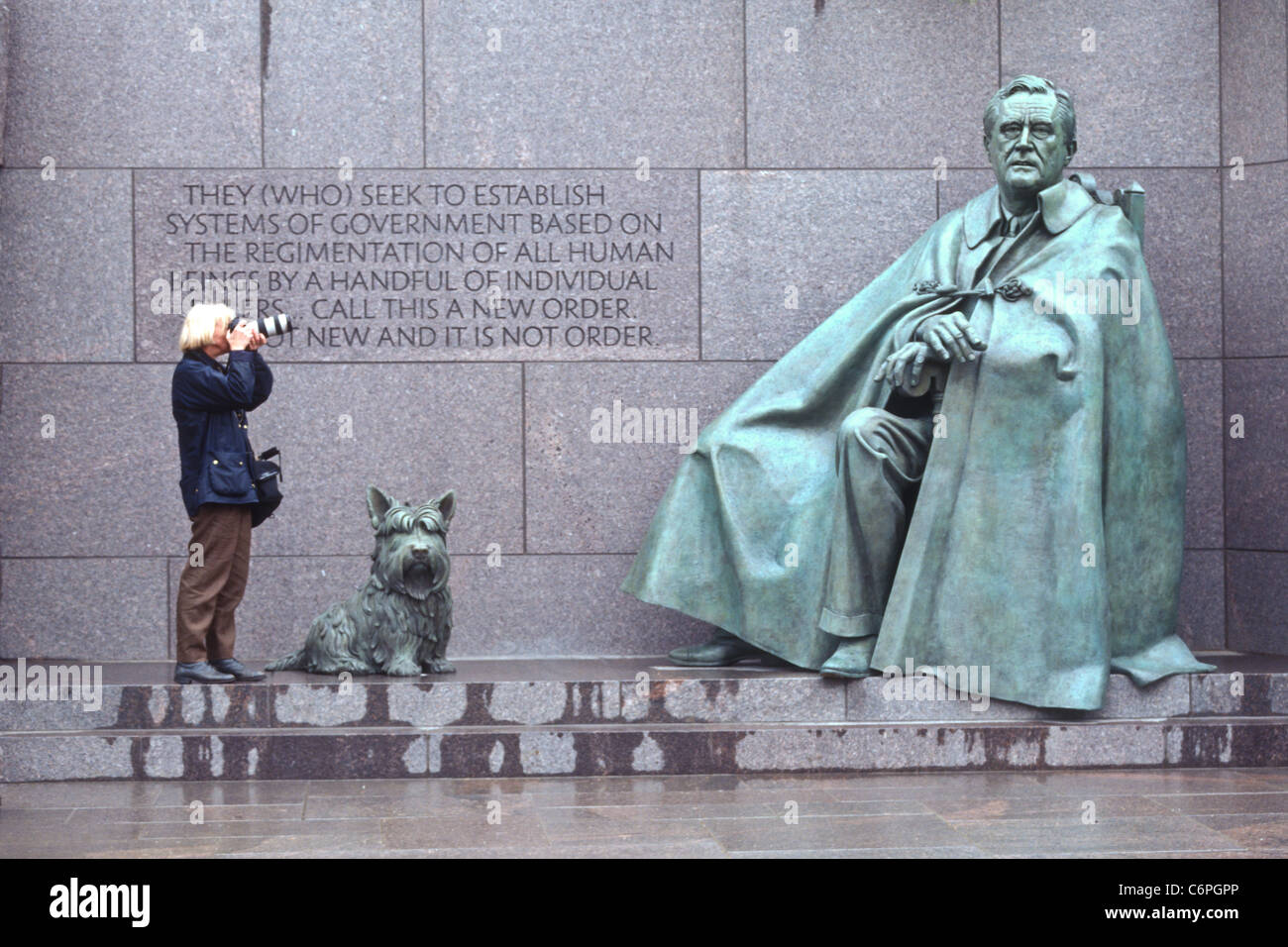 A photographer takes a picture of the statue of President Franklin D. Roosevelt at the FDR Memorial April 23, 1997 Stock Photo