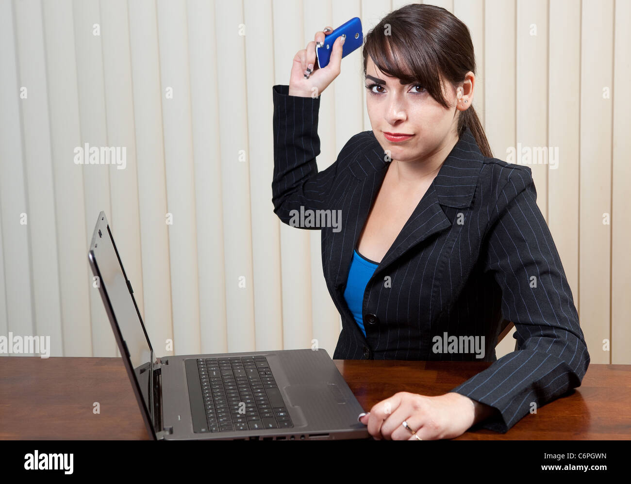 Angry woman throwing her cell phone at you Stock Photo Alamy