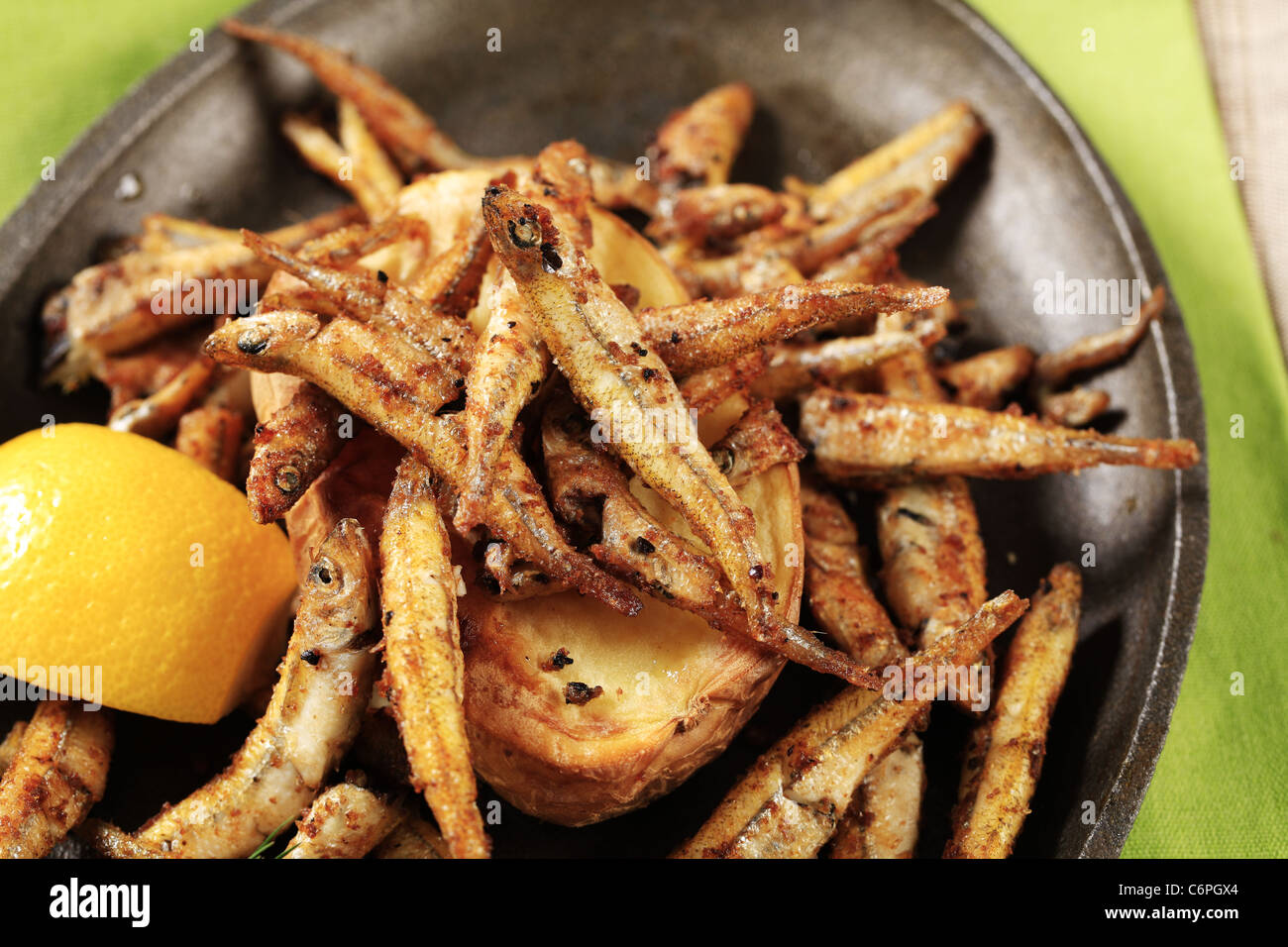 Fish, Spanish tapas - sprat with lemon on baked bread Stock Photo - Alamy