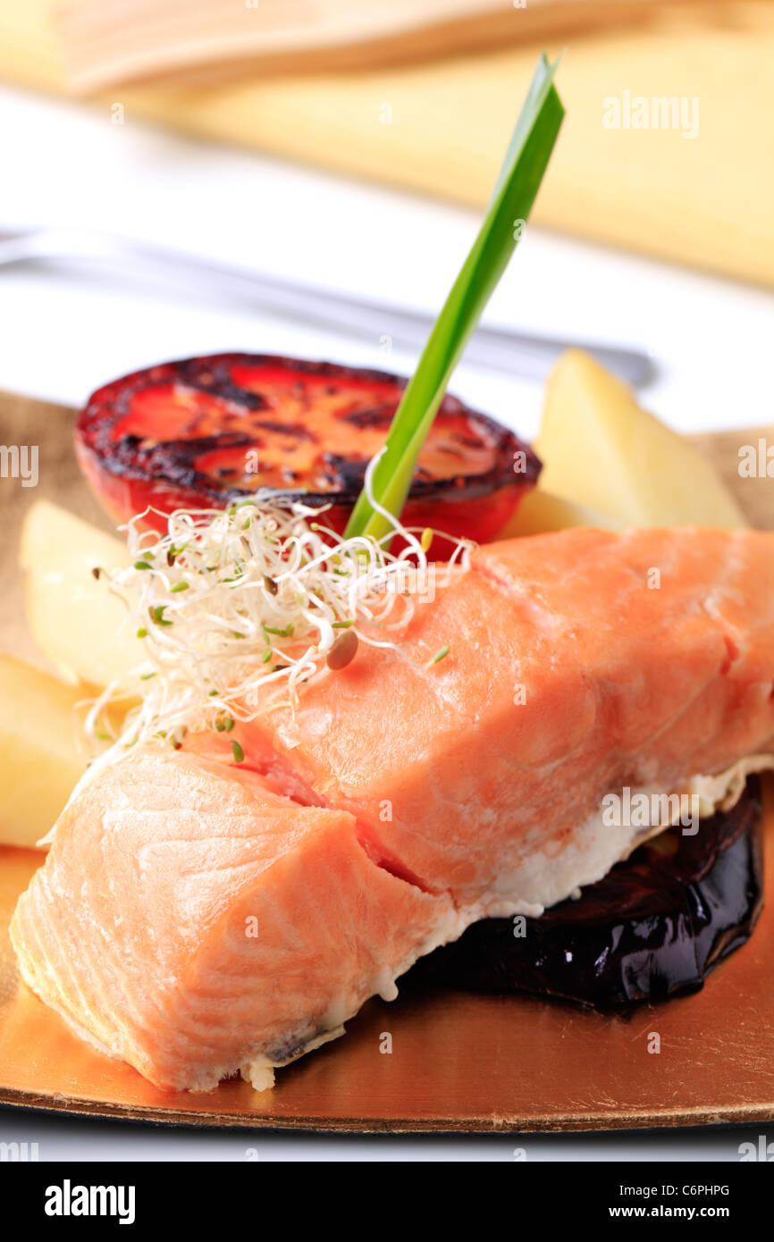 Pan fried salmon fillet, potatoes, grilled tomato and eggplant Stock