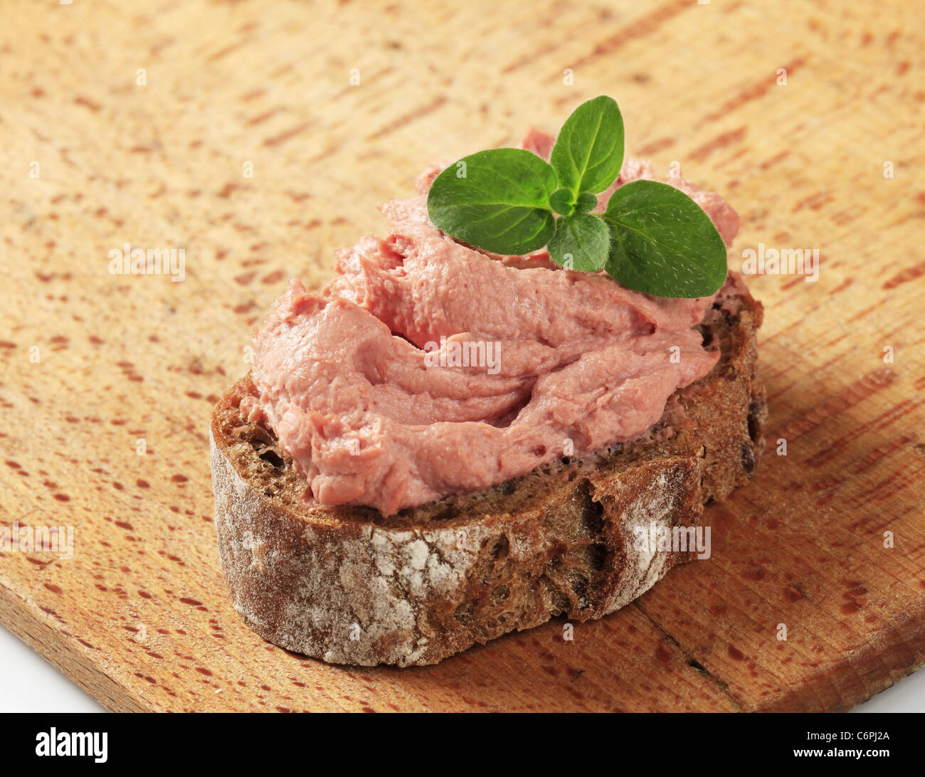 Slice of brown bread and smooth liver pate Stock Photo
