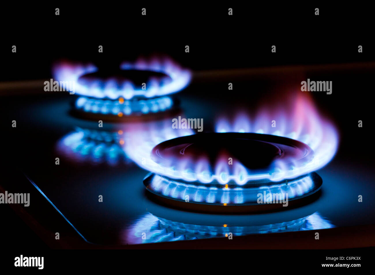 gas flames on a cooker rings Stock Photo